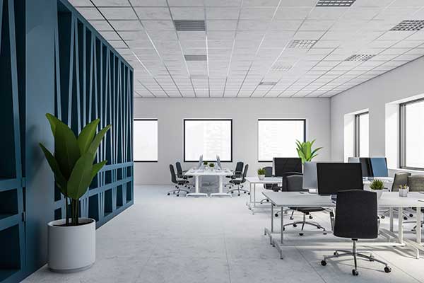 Modern blue and white office space with desks and chairs