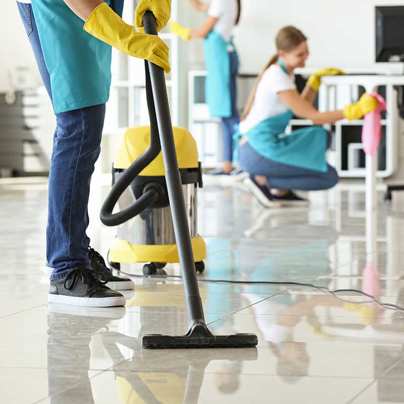 Cleaning crew cleaning up a modern office space